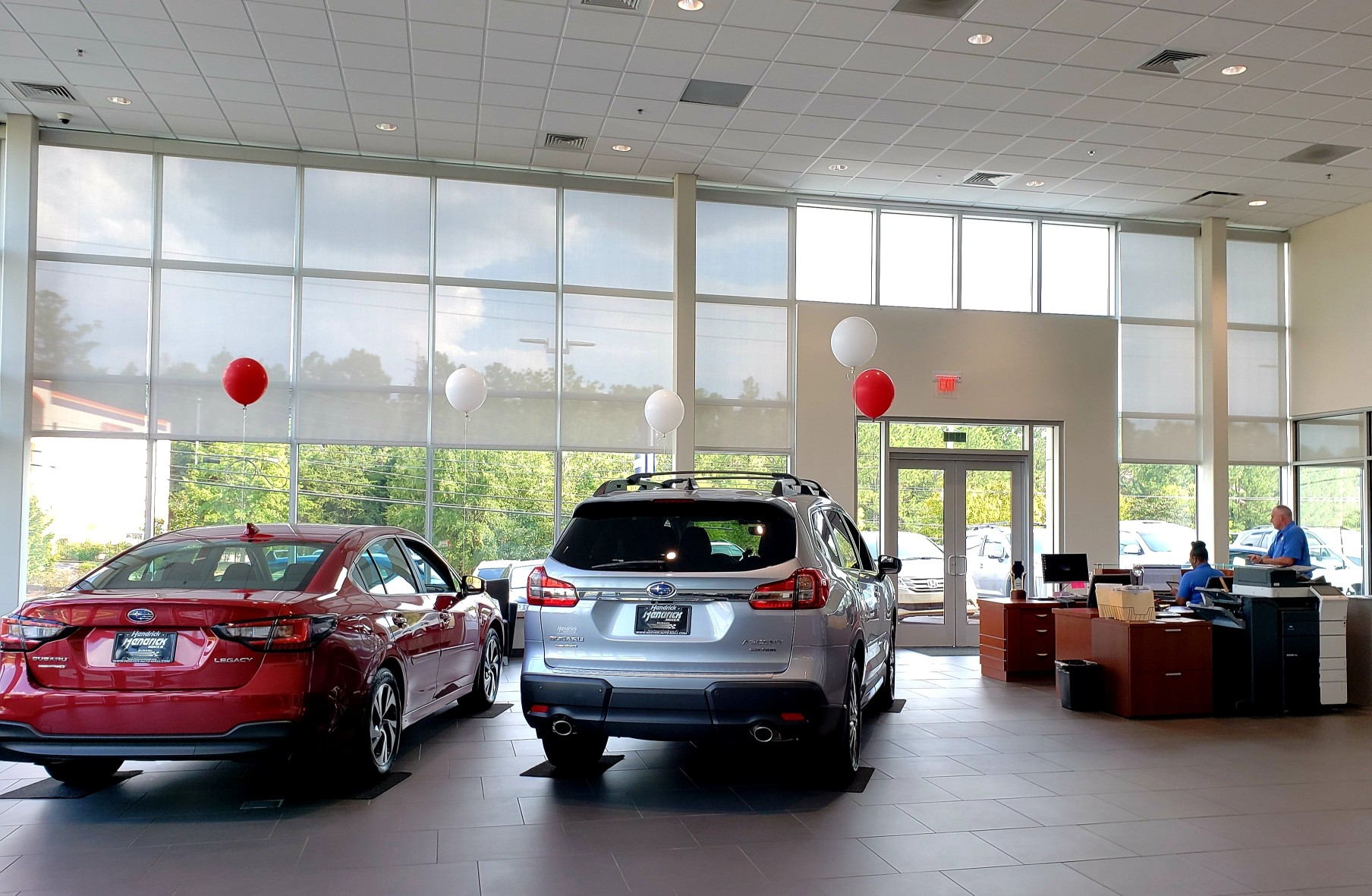 new-car-buying-car-dealership-indoor-showroom-market-vehicle-automobile-models-sale-salesman-wheels_t20_BmLoW8 (1)